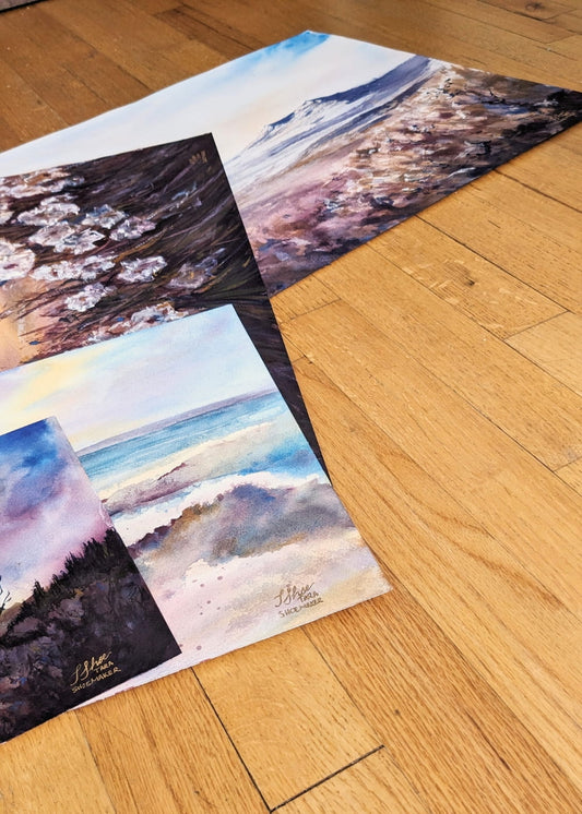 A flatlay of original paintings on paper from Tara Shoemaker Art