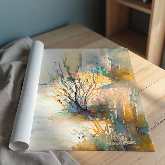 Rolled-up abstract painting art print on a wooden surface with a neutral background