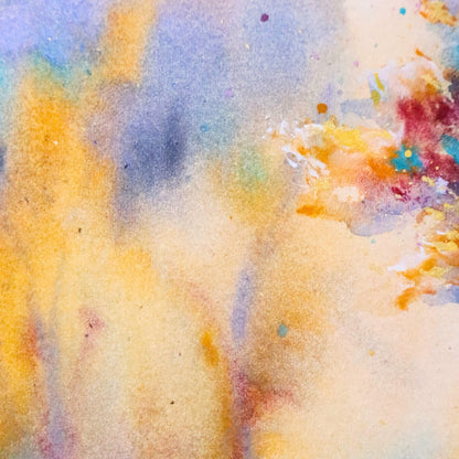 Abstract watercolor painting with a mix of yellow, blue, and red colors.