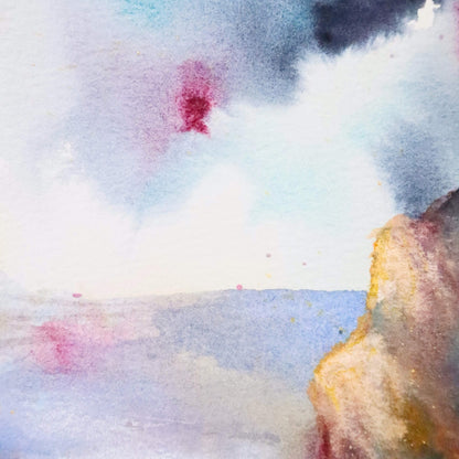 Abstract watercolor painting with colorful splashes on a textured surface