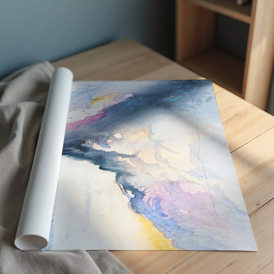 Rolled-up watercolor painting of a landscape on a wooden surface