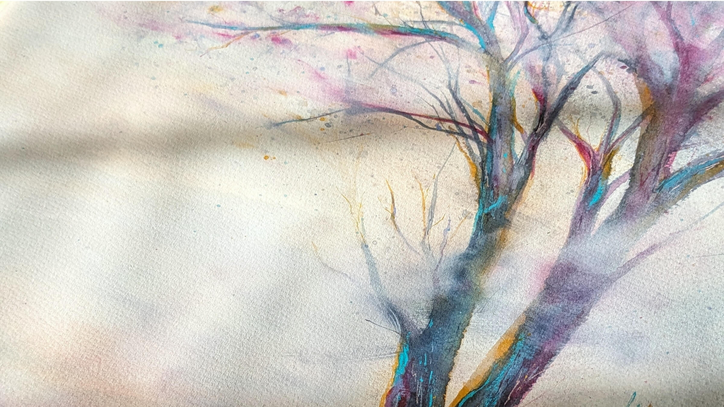 Artistic depiction of a tree with colorful branches on a light background