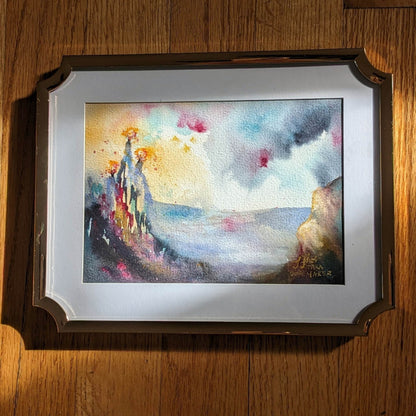 Video zooming in on a colorful abstract landscape painting.